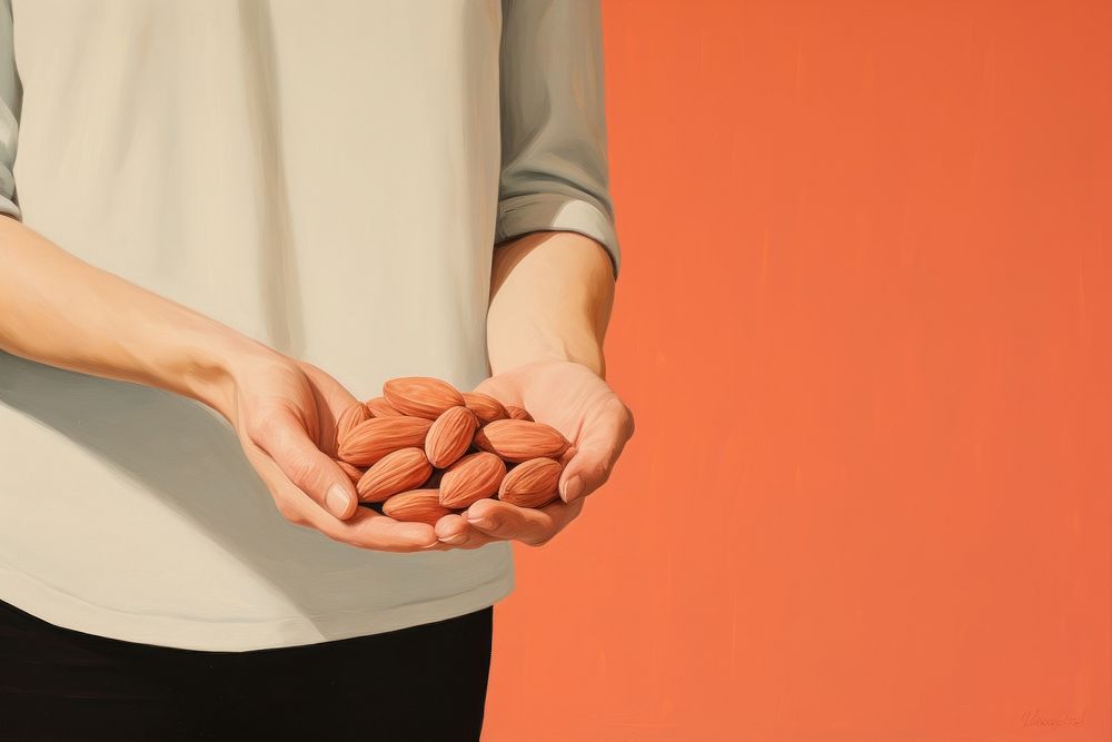 Hand holding almonds food midsection medication.