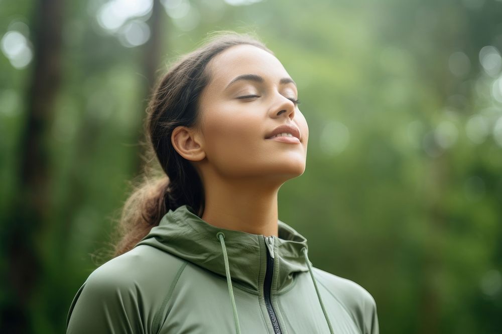 Woman in sport wear breathing fresh air portrait sports adult. 