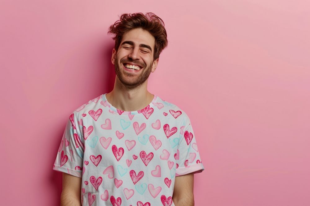 Wearing heart-shaped matching shirts laughing smiling adult.
