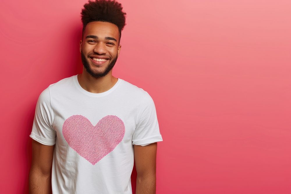 Wearing heart-shaped matching shirts smiling adult love.