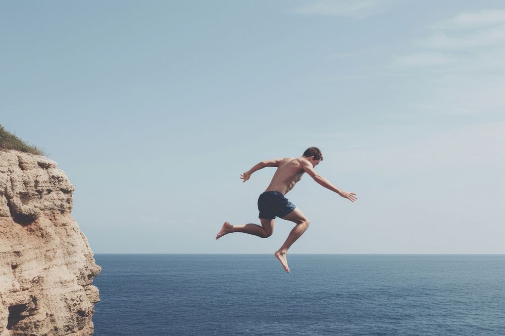 Sea jumping diving cliff. AI generated Image by rawpixel.