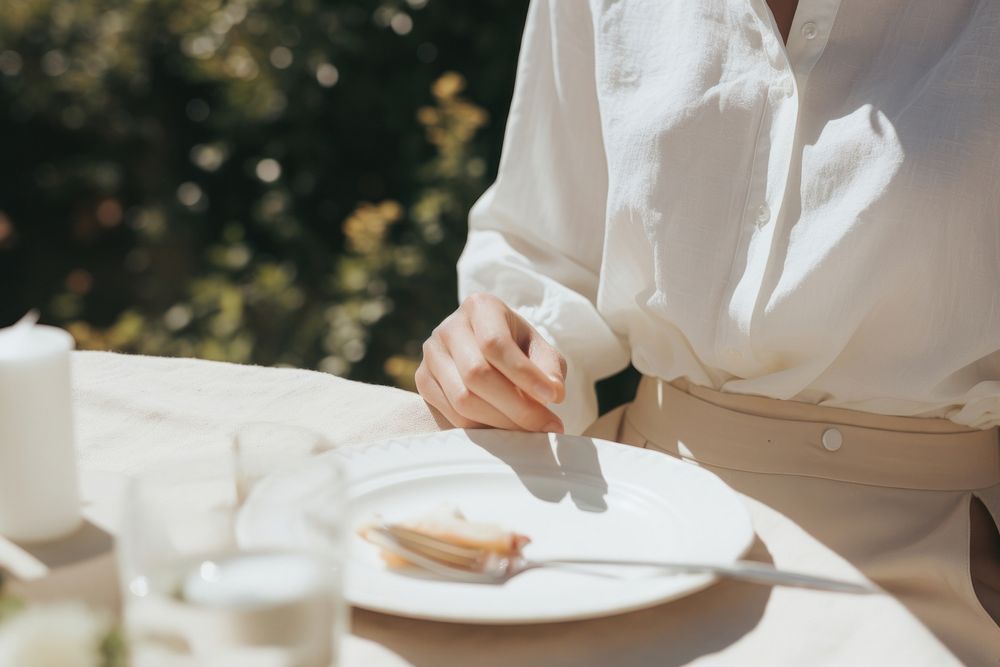 A woman dining in the garden adult food refreshment. AI generated Image by rawpixel.