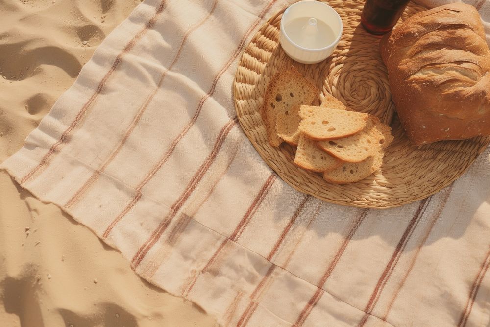Beach picnic bread food tablecloth. AI generated Image by rawpixel.