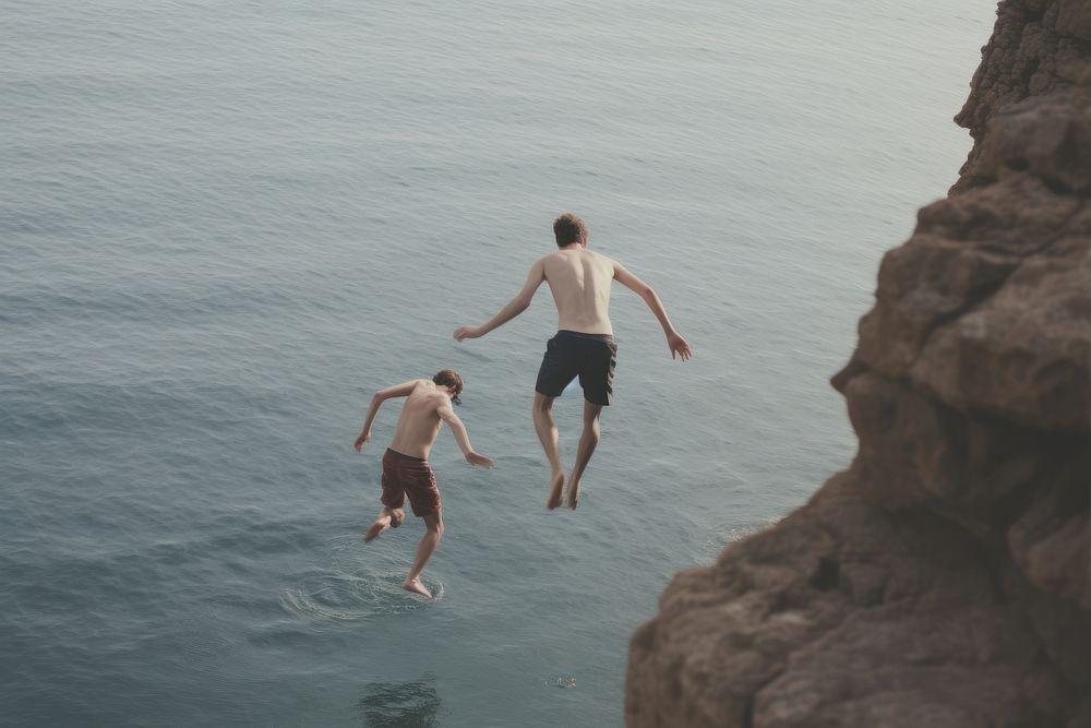 Sea cliff outdoors jumping. AI generated Image by rawpixel.