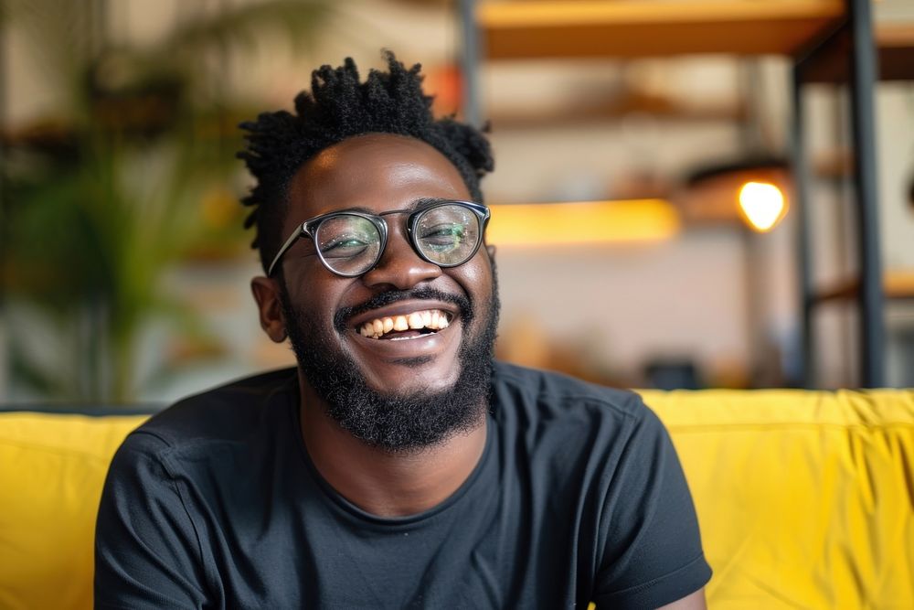Black man portrait laughing glasses.