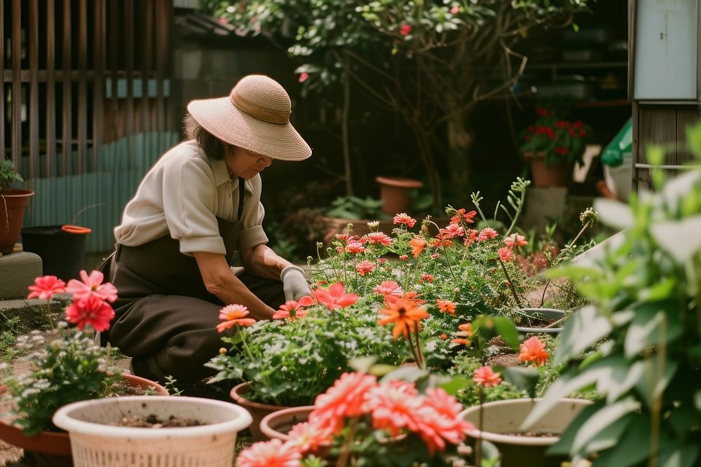 Florist doing gardening outdoors nature plant.