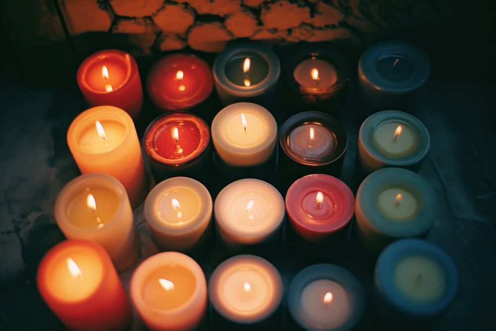 Lots of candle spirituality arrangement illuminated.
