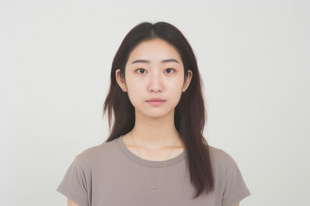 Asian girl piercing septum portrait adult white background.