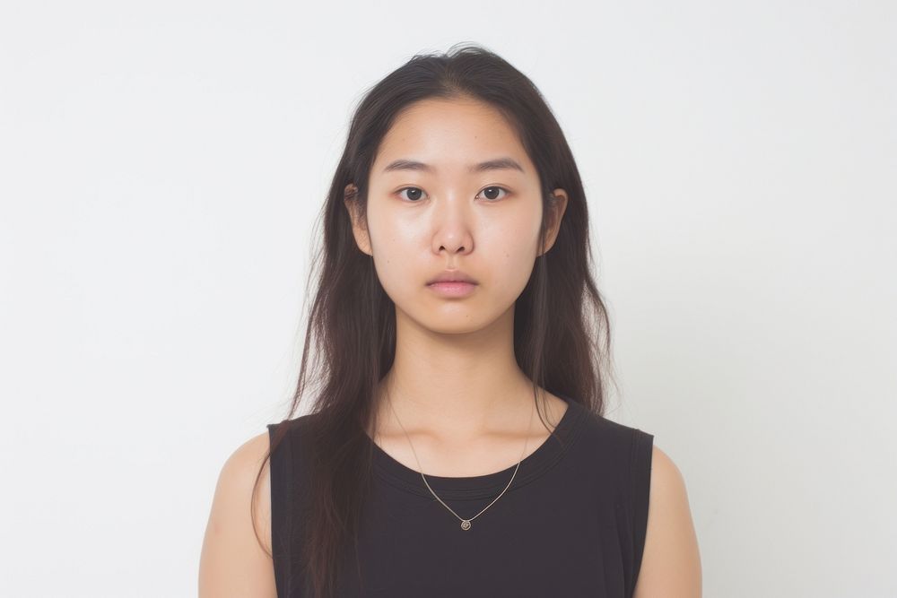 Asian girl piercing septum portrait necklace white background.