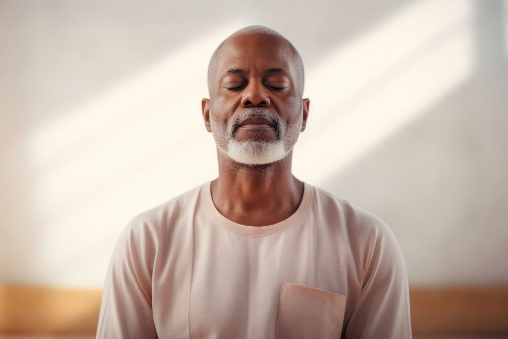 Mature guy meditating adult contemplation spirituality.