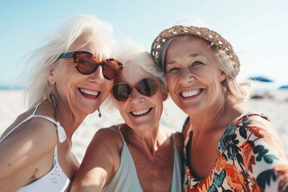 Old women friends sunglasses laughing portrait.