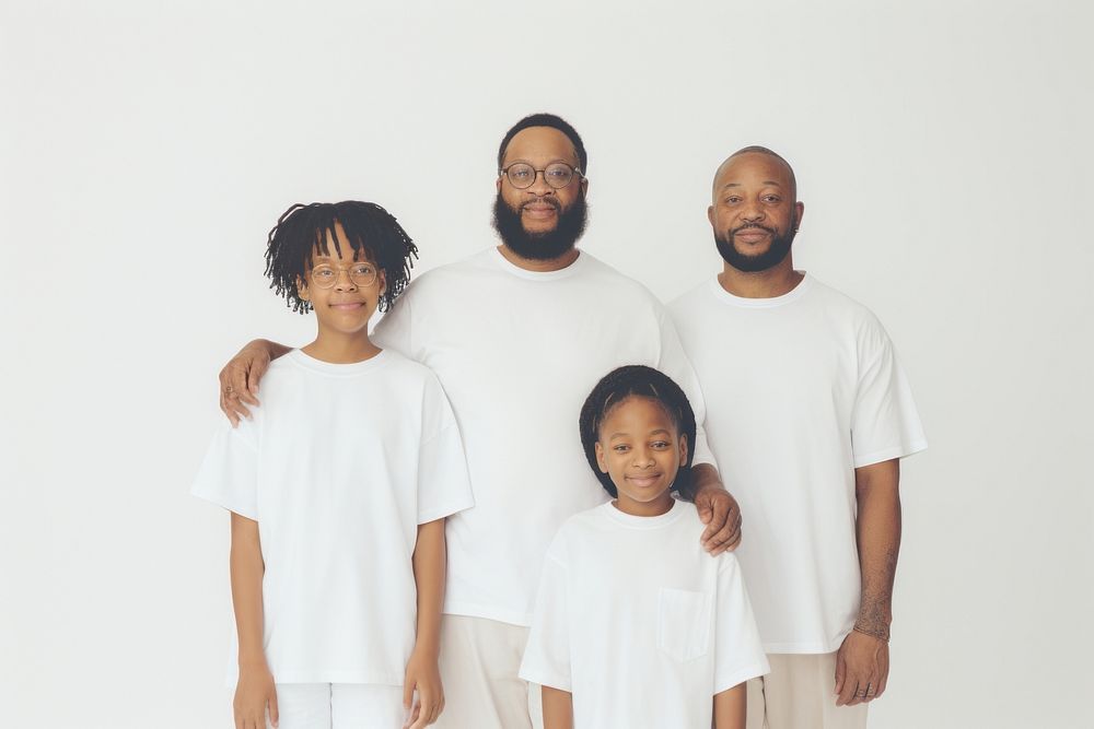 Black family wearing blank white shirt poses at studio for portrait pictures t-shirt parent sleeve.
