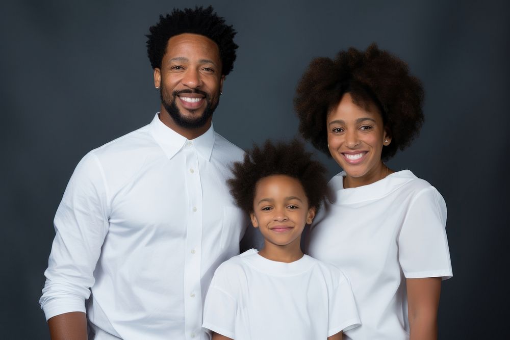 Black family wearing blank white shirt poses at studio for portrait pictures parent adult photo.