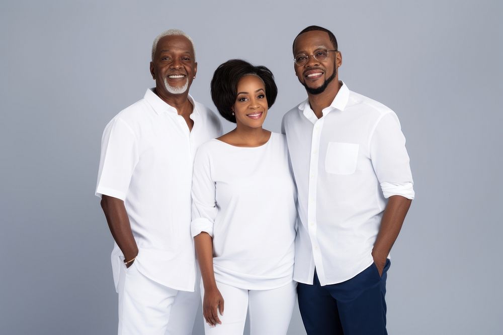 Black family wearing blank white shirt poses at studio for portrait pictures parent adult togetherness.