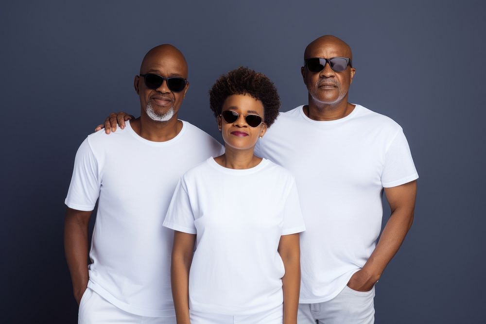 Black family wearing blank white shirt poses at studio for portrait pictures sunglasses t-shirt parent.