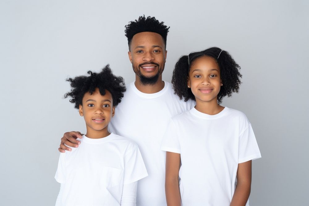 Black family wearing blank white shirt poses at studio for portrait pictures t-shirt parent photo.