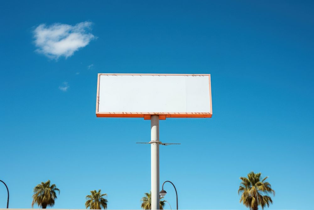 Blank white retro 1960s restaurant sign in california billboard blue sky.