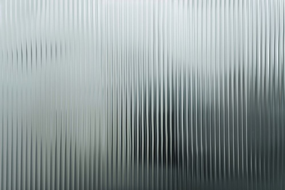 Reeded glass surface gray backgrounds texture.