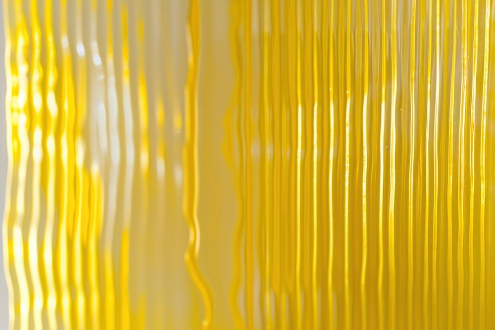 Yellow reeded glass backgrounds toothbrush abstract.