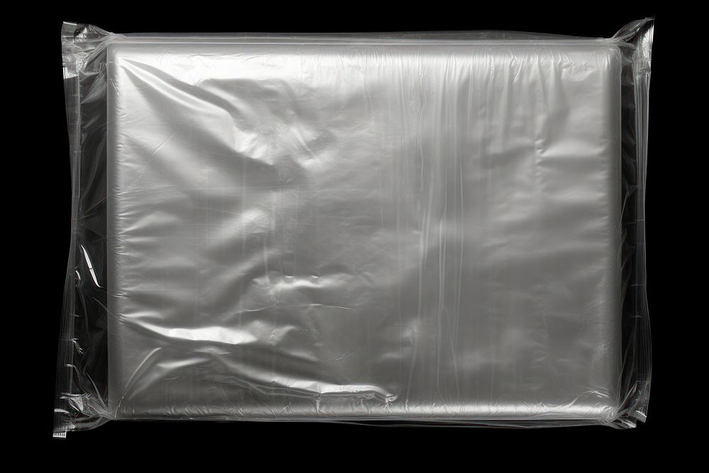  Transparent plastic wrap bag black background monochrome. AI generated Image by rawpixel.