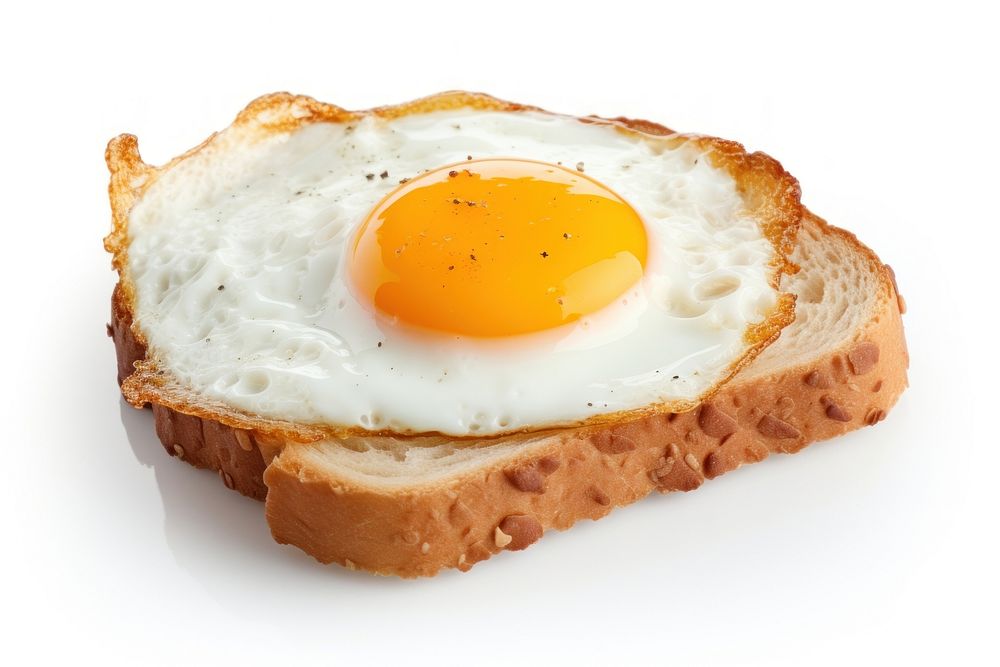The perfect fried egg on toast bread food white background.