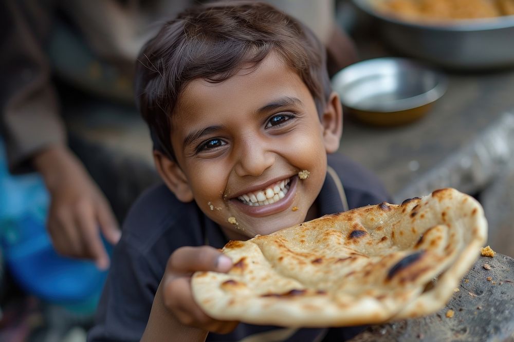Indian kid eating food bread child.