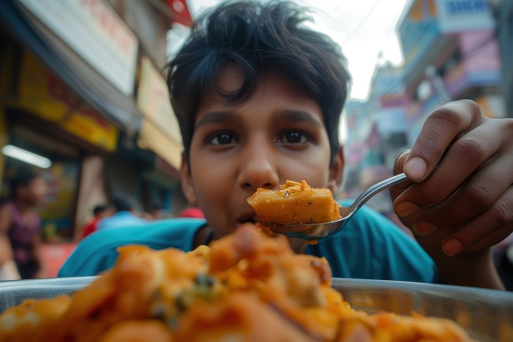 Indian teenager eating food street food freshness.