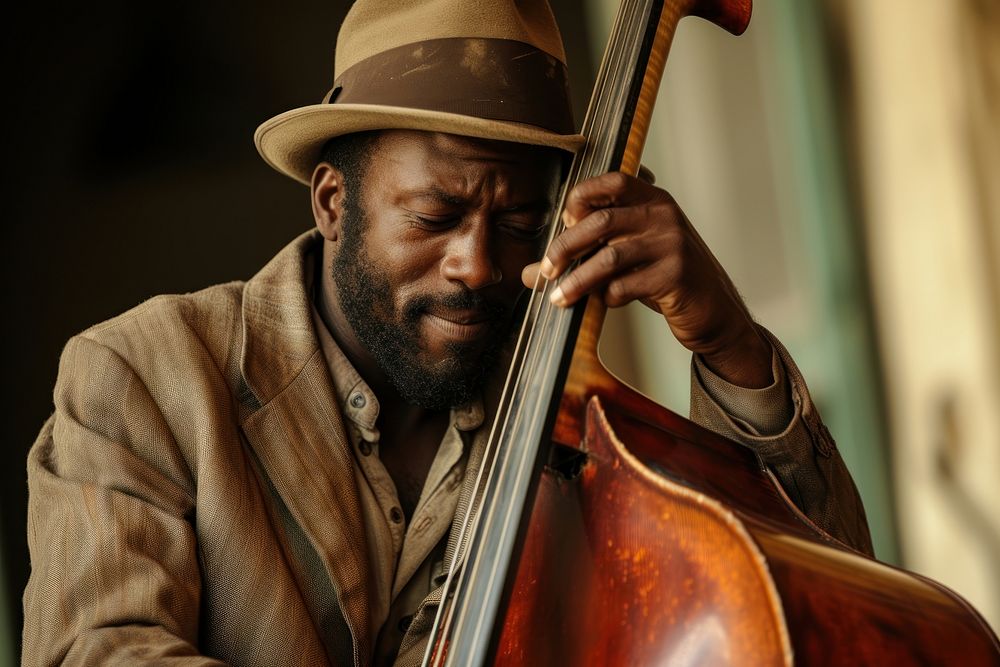 Black musician passionate playing cello.