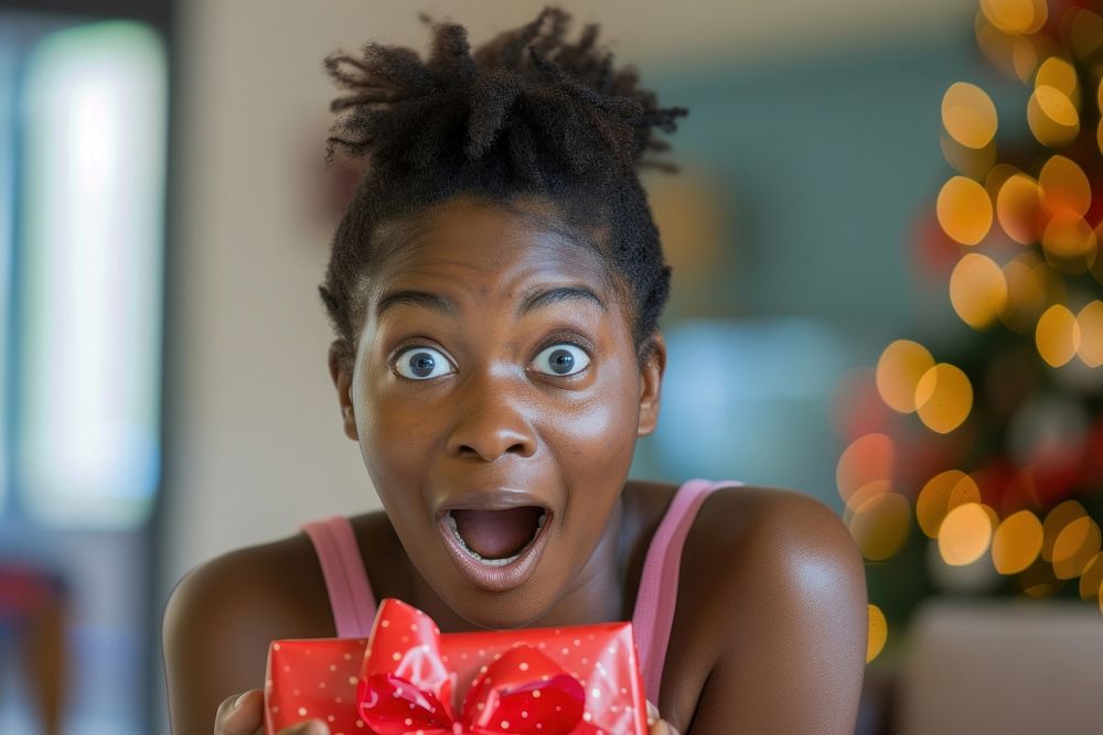 Surprised black person reacting gift.