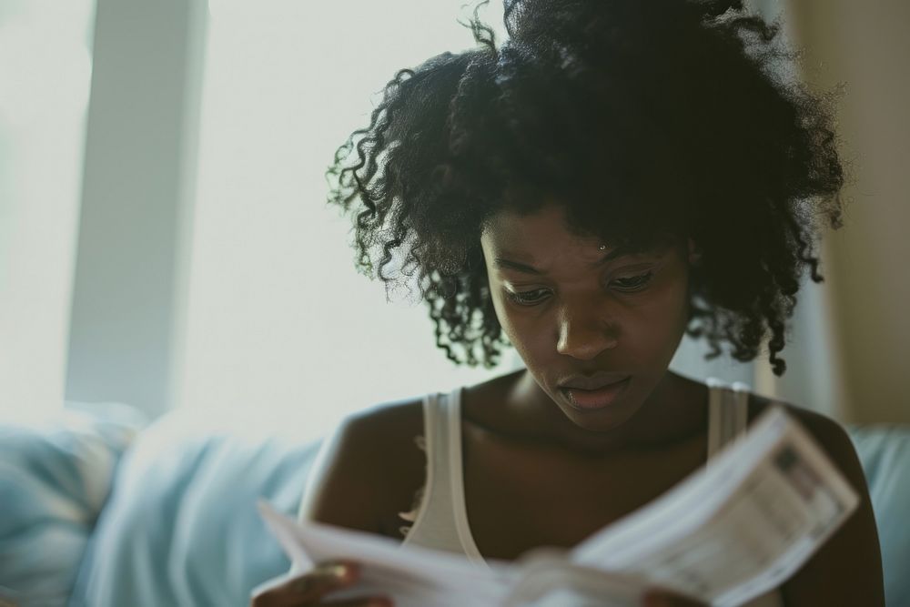 Black woman portrait reading looking.