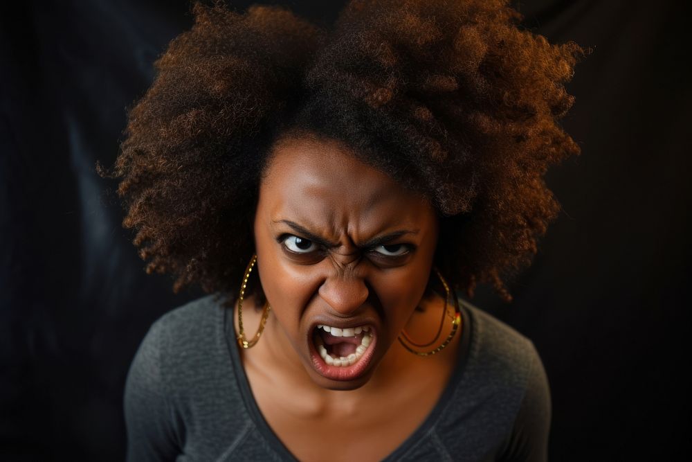Black woman portrait shouting furious.