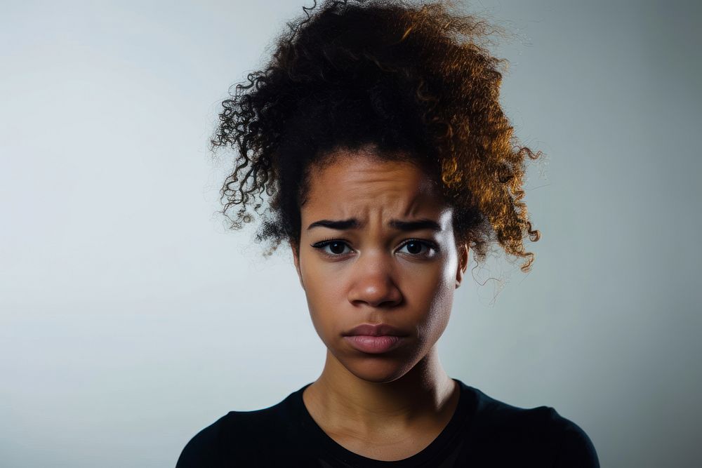 Black woman portrait worried crying.