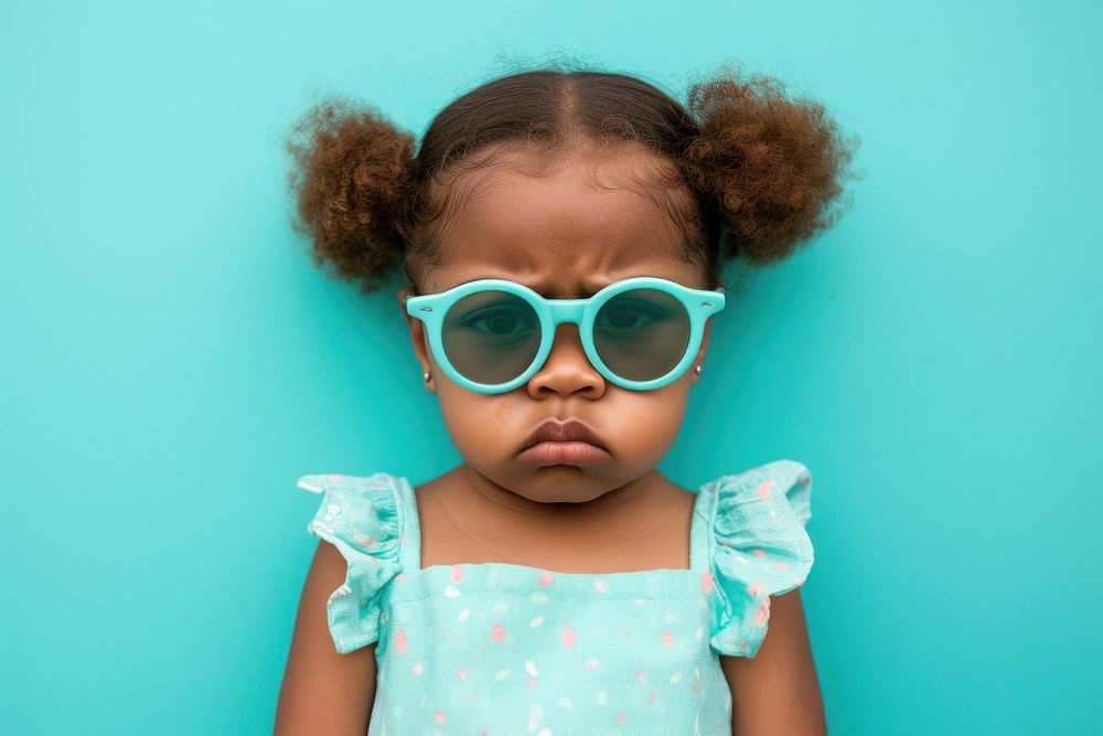 Cool baby black girl with fashionable clothing style full body on colored background sunglasses portrait fun.