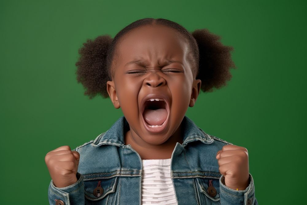 Cool baby black girl with fashionable clothing style full body shouting fun frustration.