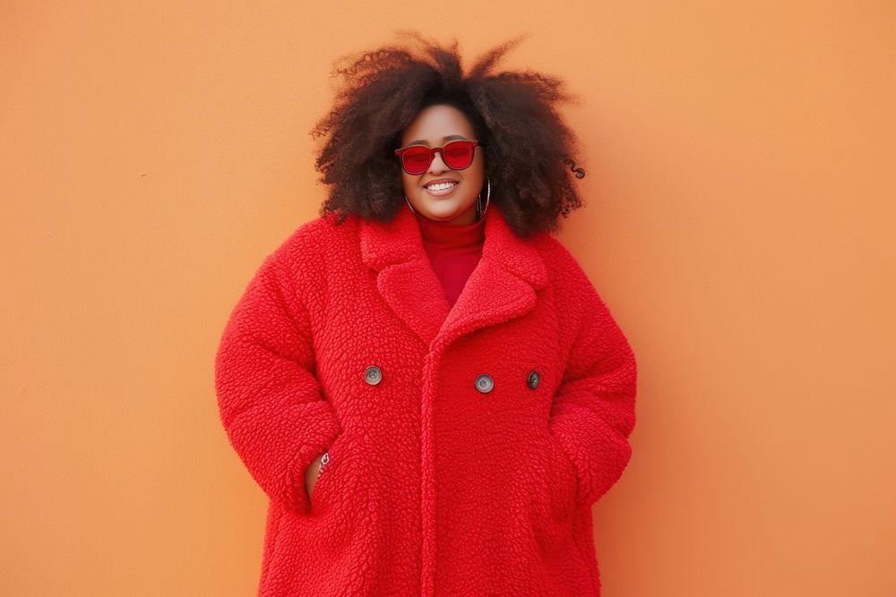 Cool chubby young black woman with fashionable clothing style full body on colored background portrait sweater coat.