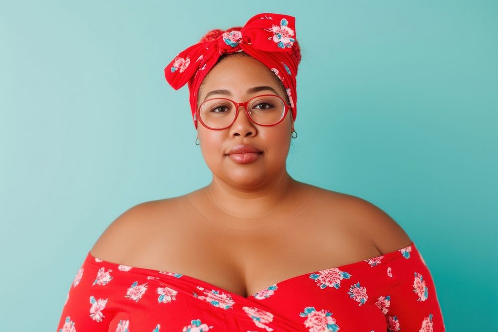 Cool chubby young black woman with fashionable clothing style full body on colored background portrait glasses individuality.