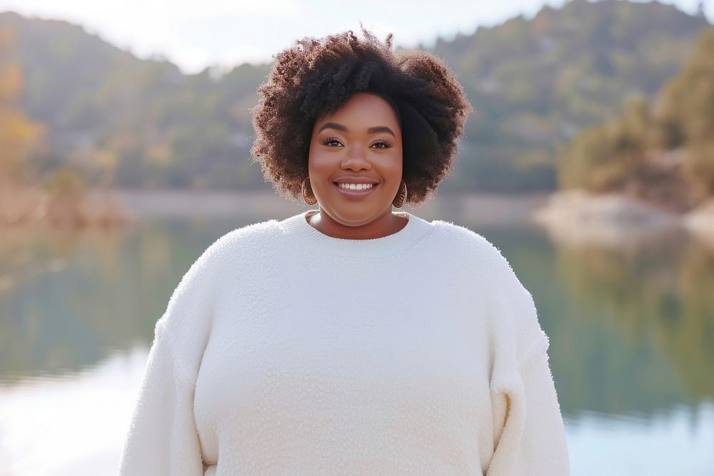 Cool chubby young black woman with fashionable clothing style full body on colored background sweater adult smile.