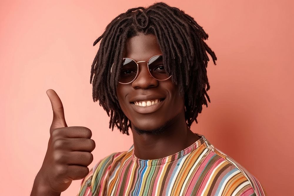 Cool young black man with fashionable clothing style full body on colored background glasses smile accessories.