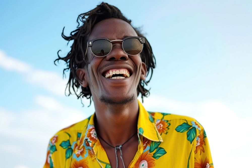 Cool young black man with fashionable clothing style full body on colored background laughing glasses smile.