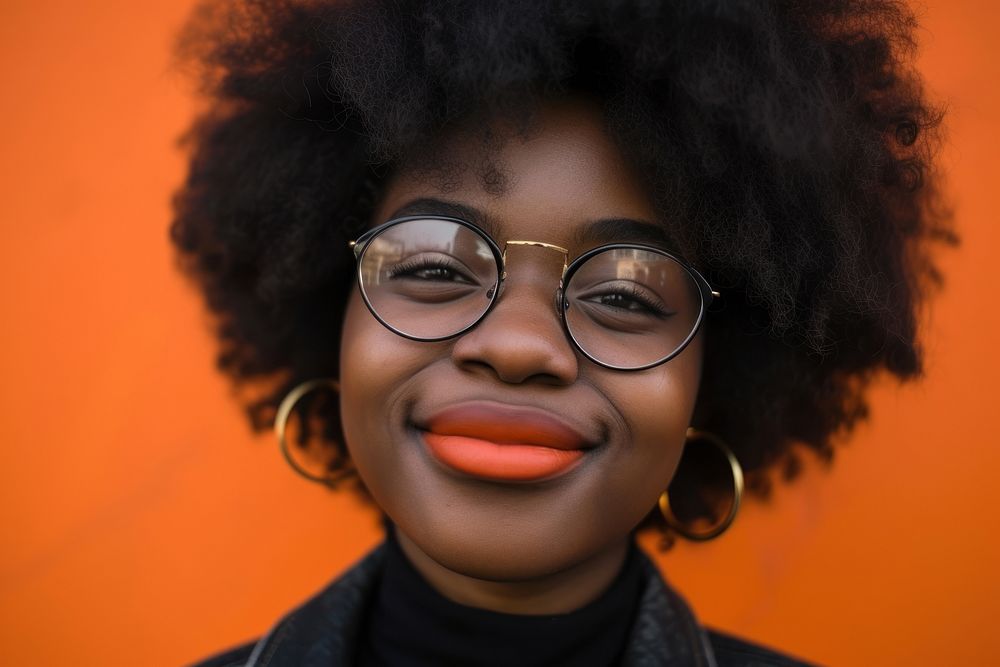 Cool young black woman with fashionable clothing style full body on colored background portrait glasses smile.
