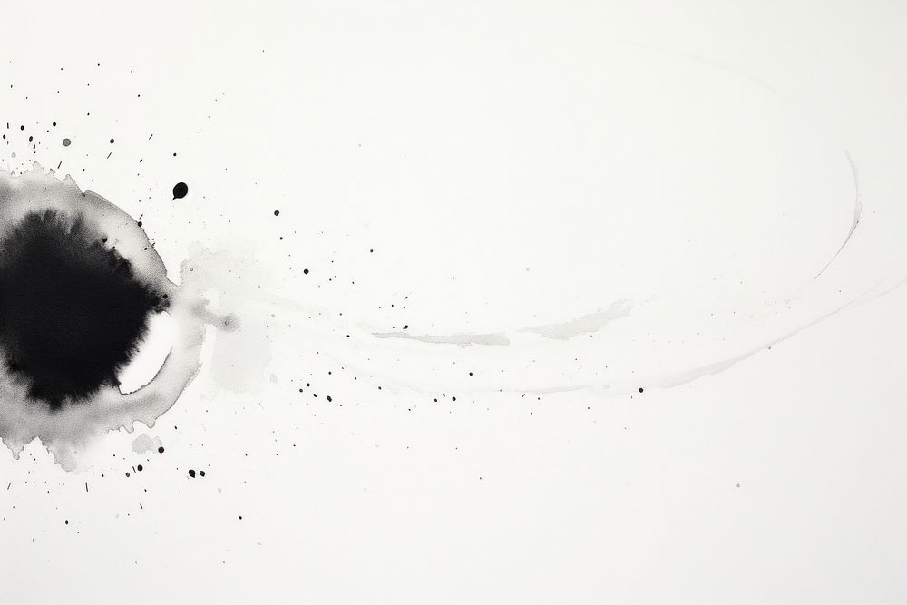 Ink dropes on white paper backgrounds black splattered.