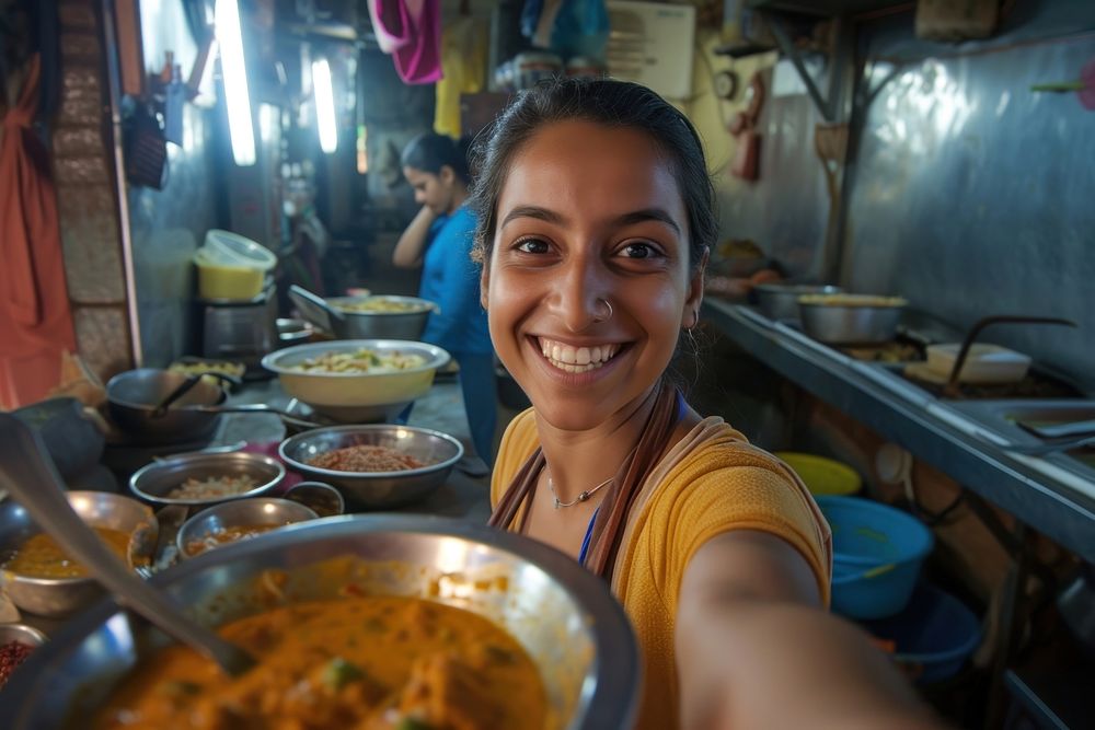 Indian waitress serving food smiling smile.