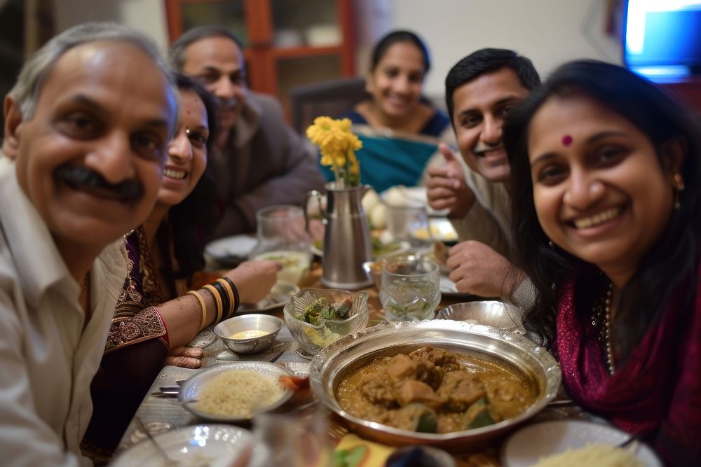 Indian family dinner food smiling adult.