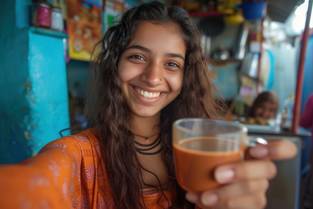 Indian girl making portrait smiling coffee.