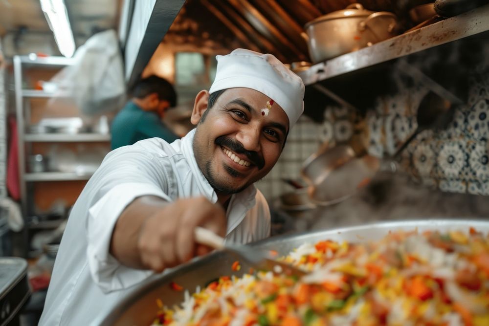 Indian chef cooking smiling adult food.