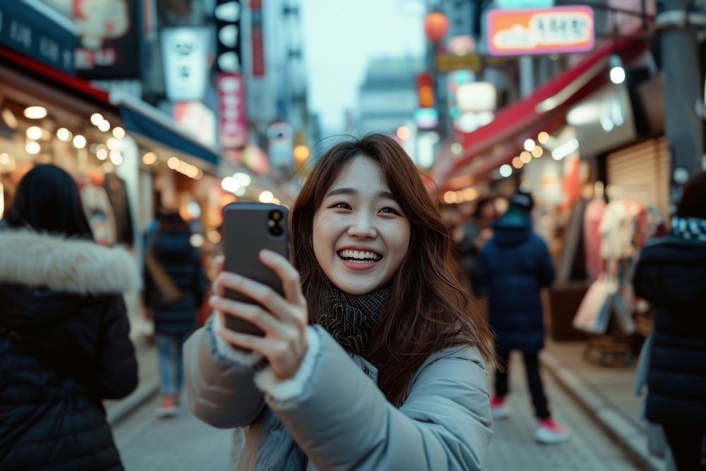 Korean vlogger live on street selfie adult phone.