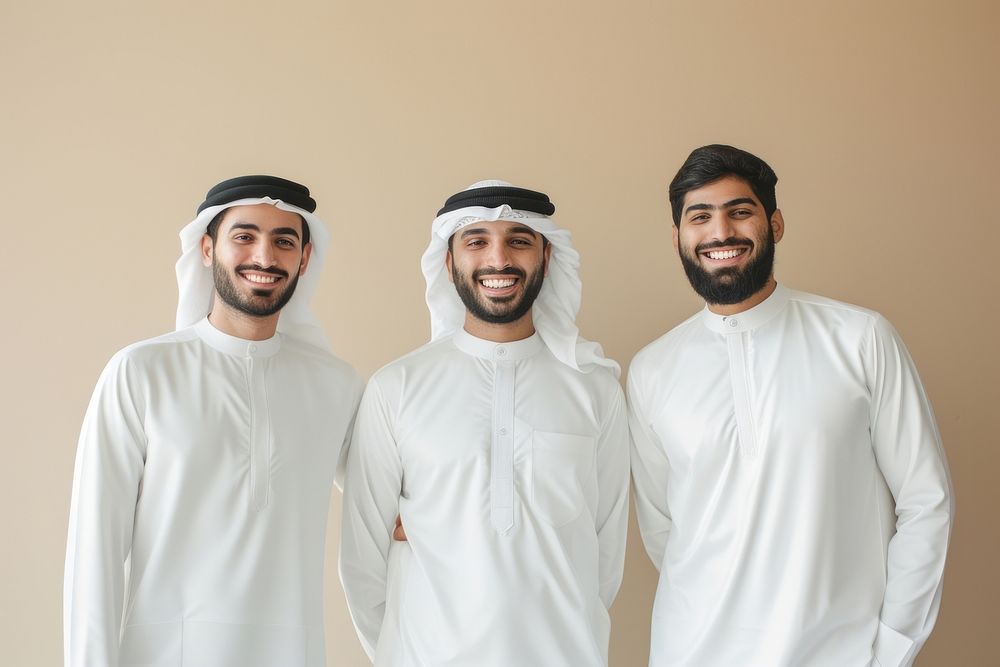 3 Middle eastern men in thawb smiling people adult.