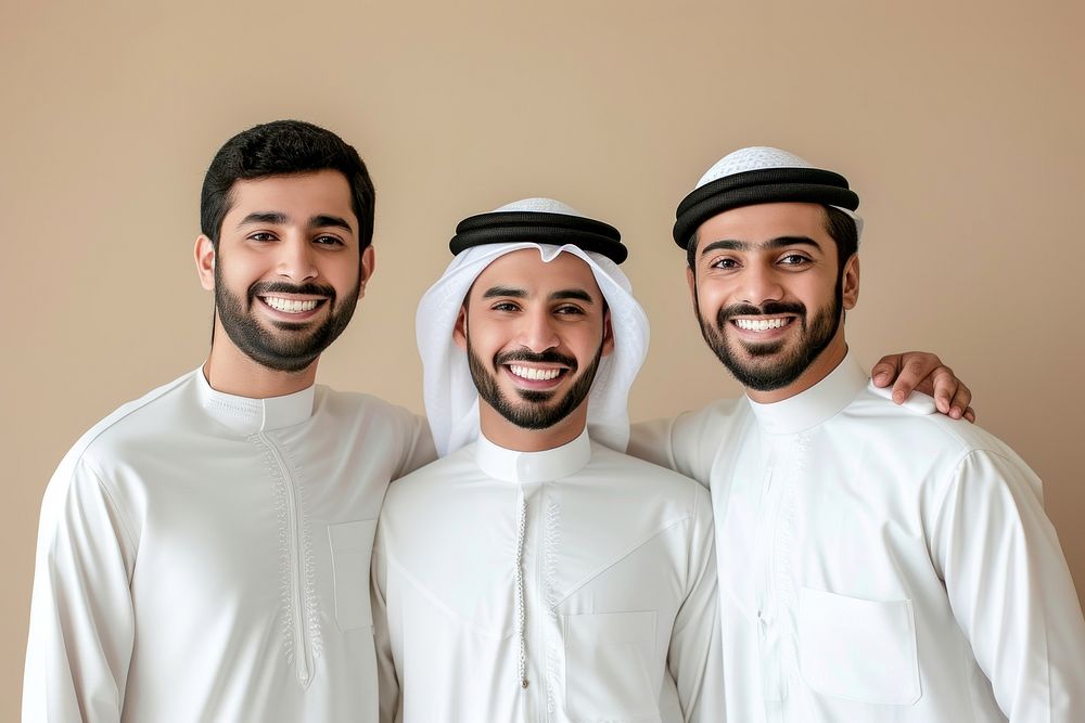 3 Middle eastern men in thawb smiling people adult.
