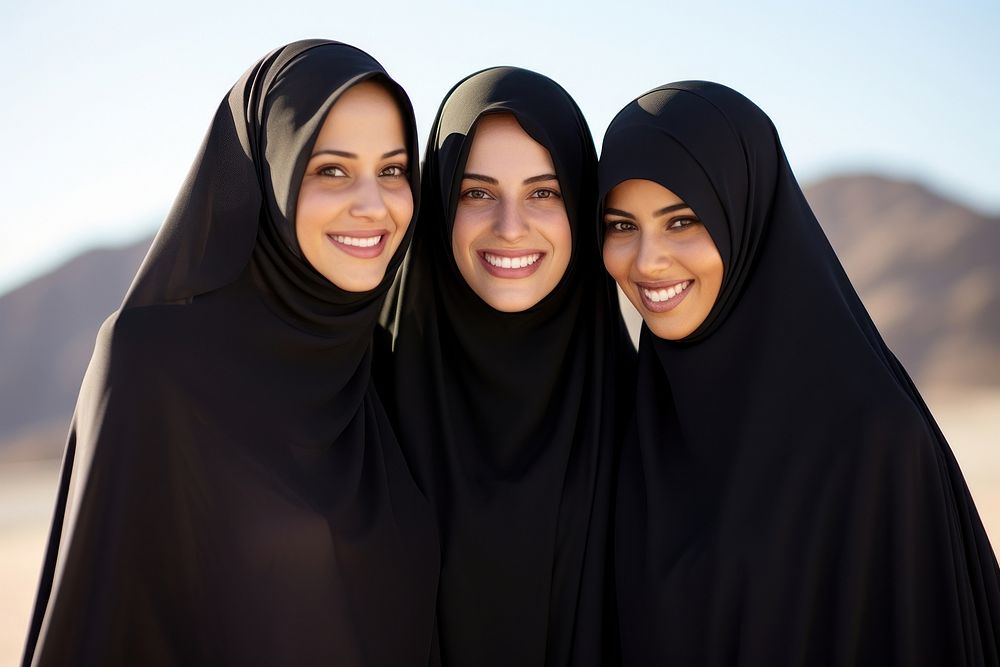 3 Middle eastern women outdoors smiling people.