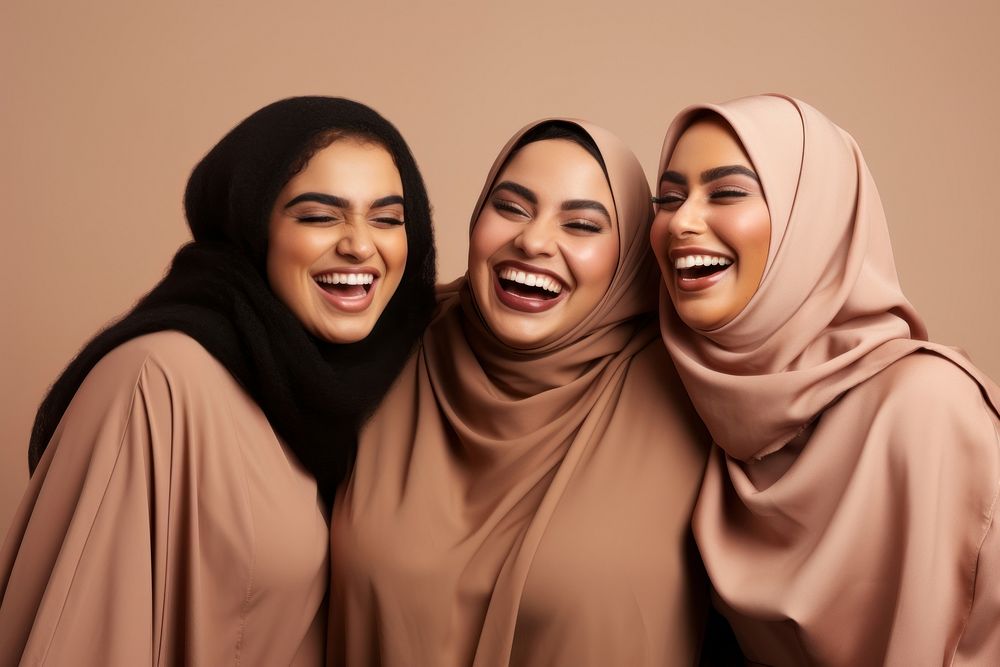 3 plus size Middle eastern women laughing smiling people.